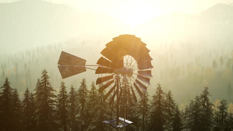 Typical-Old-Windmill-turbine-in-forest-at-sunset